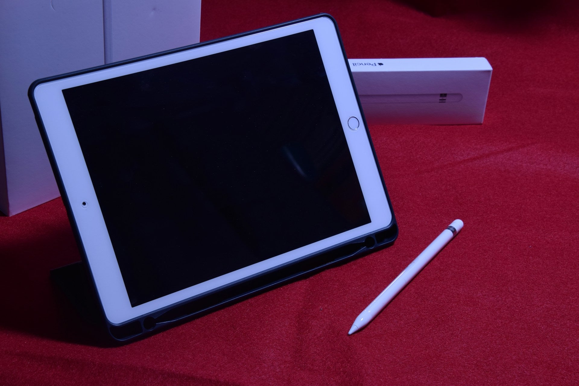 iPad with a blank screen placed on a desk, showing no display or response, ready for professional repair in Manchester
