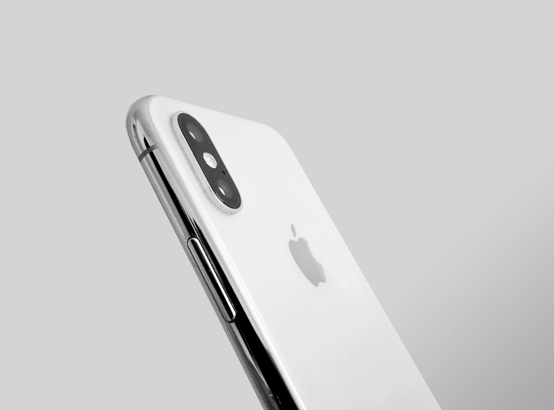 Silver grey Apple iPhone XS showing back views with sleek design and Super Retina display, perfect for showcasing iPhone XS expectations.