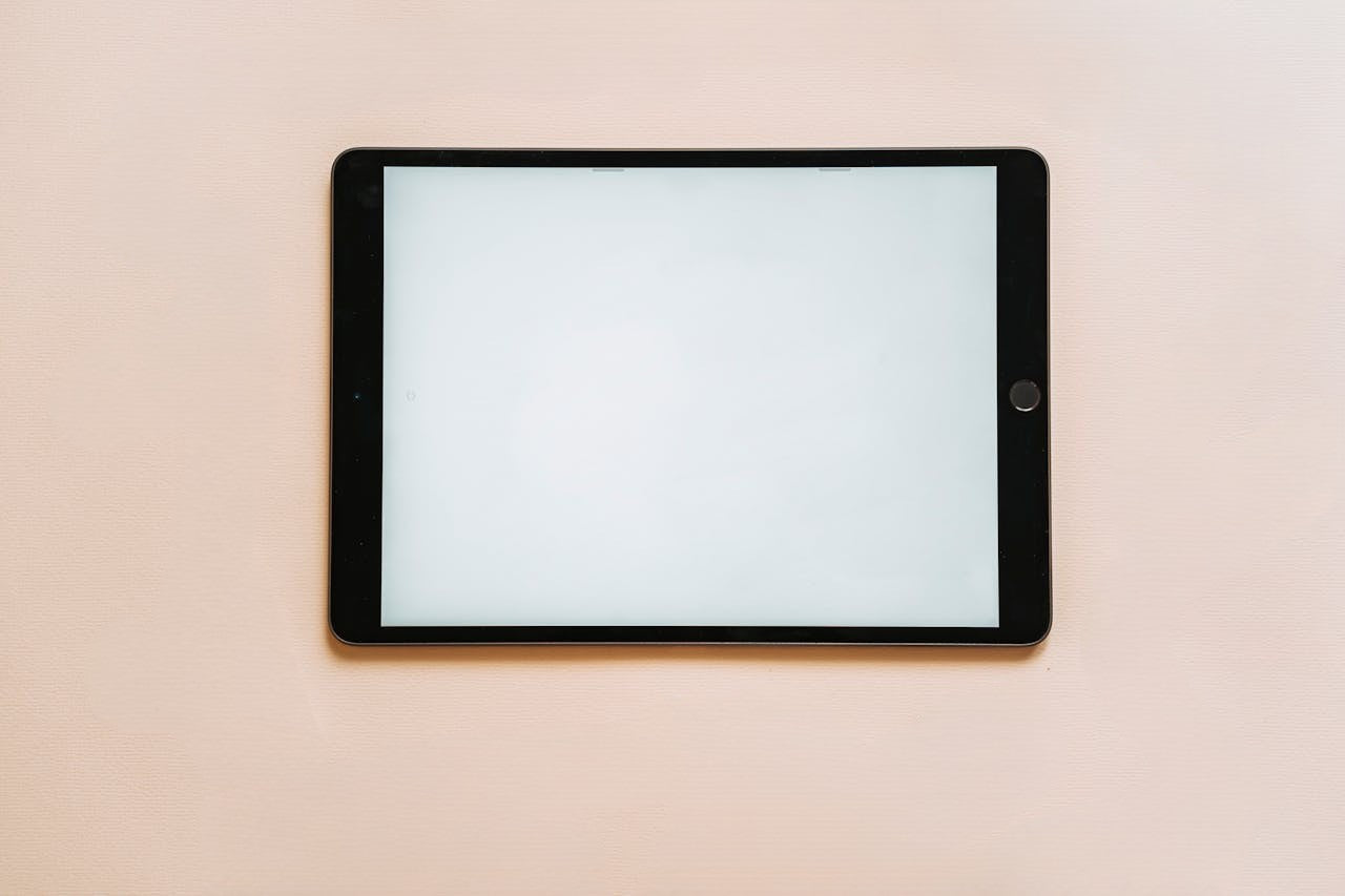 Tablet with blank screen placed on a surface, highlighting the need for tablet repair in Manchester