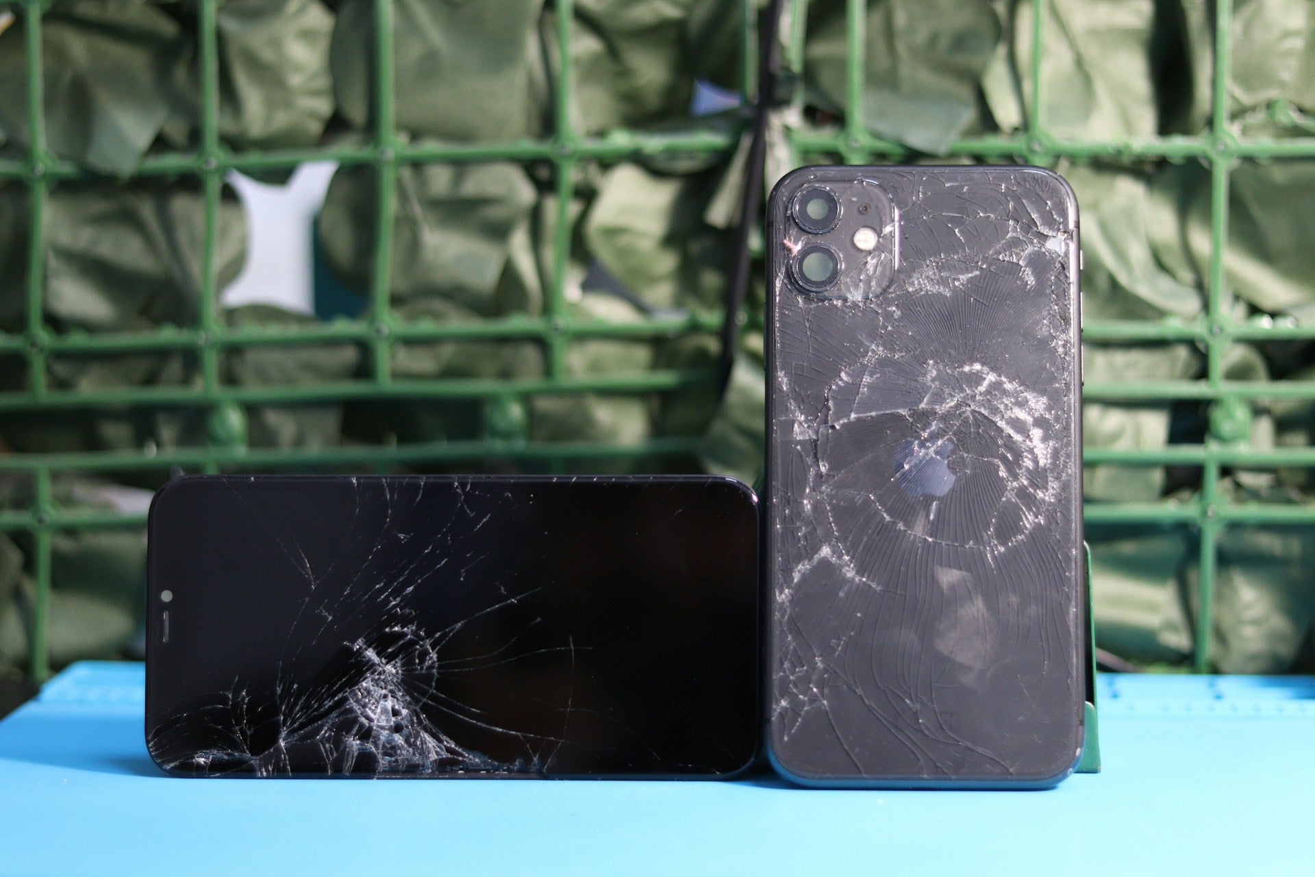 Cracked iPhone screen highlighting repair cost concerns in the UK