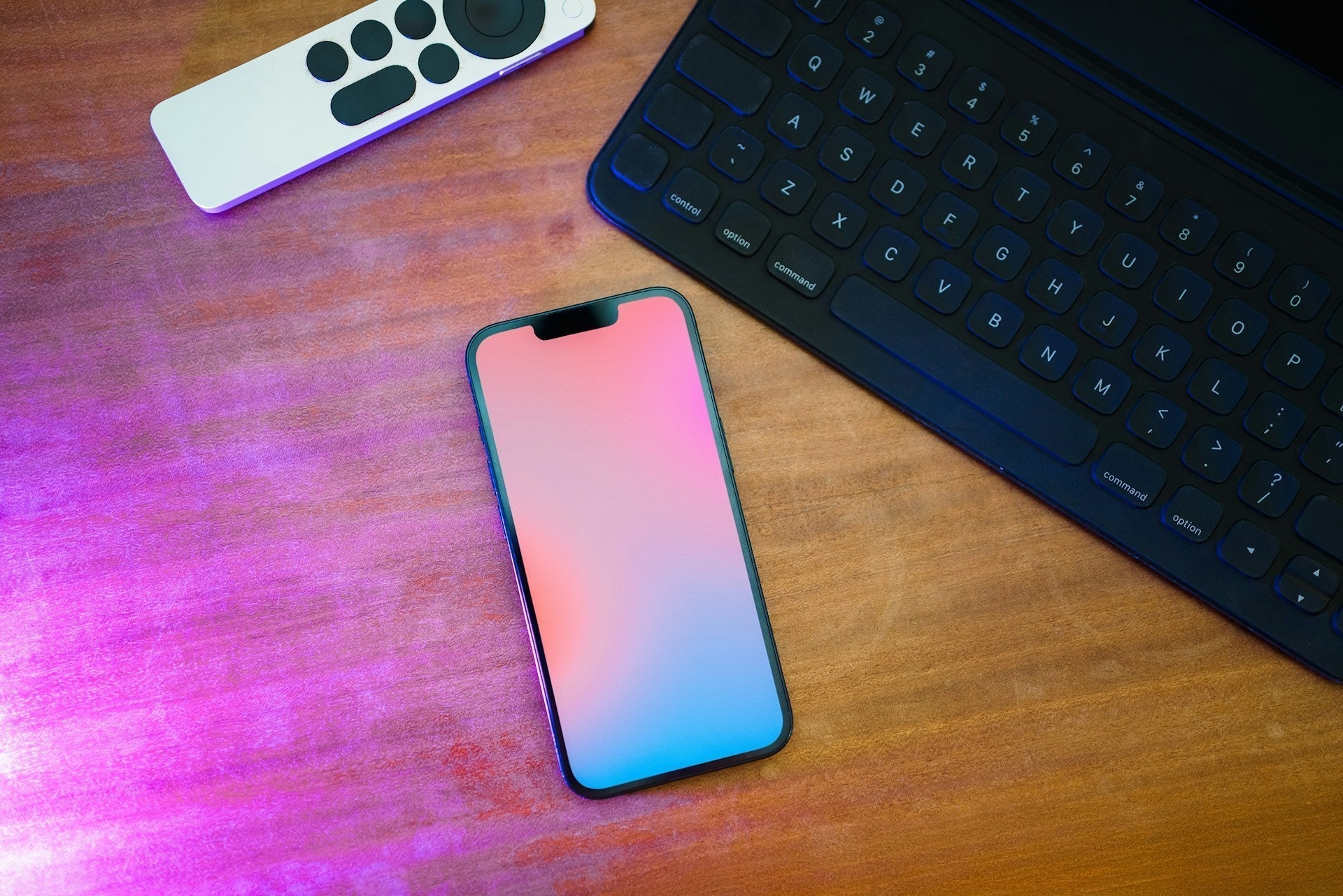 iPhone placed on a wooden table, ready for storage cleanup to free up space.